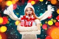 Christmas and New Year holidays. Surprised woman holding gift boxes on winter background with snow in black friday, Sale Royalty Free Stock Photo