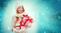 Shopping woman holding gift boxes on winter background with snow in black friday, Christmas and New Year holidays. Sale Royalty Free Stock Photo