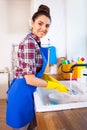 Beautiful young woman makes cleaning the house. Girl cleaning kitchen. Set.