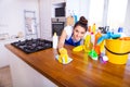 Beautiful young woman makes cleaning the house. Girl cleaning kitchen. Set.