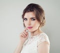 Beautiful young woman with makeup and bridal hairstyle. Pretty girl bride, face closeup Royalty Free Stock Photo