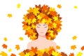 Beautiful young woman with maple leaves on her head