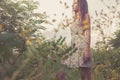 Beautiful Young Woman in Meadow of Flowers. Royalty Free Stock Photo