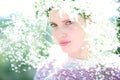 Beautiful young woman on the meadow with white flowers on a warm Royalty Free Stock Photo