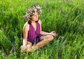 Beautiful young woman meditating in meadow Royalty Free Stock Photo