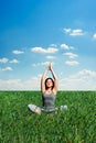 Beautiful young woman meditating at the meadow Royalty Free Stock Photo