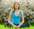 Beautiful young woman meditating outdoors Royalty Free Stock Photo