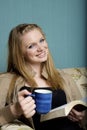 Beautiful Young Woman with morning coffee and bibl Royalty Free Stock Photo