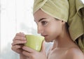 Beautiful young woman with morning cup of hot beverage. Royalty Free Stock Photo