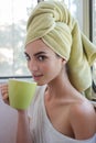 Beautiful young woman with morning cup of hot beverage. Royalty Free Stock Photo