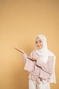 woman muslim asian woman presenting dressed in the hijab modern style Royalty Free Stock Photo