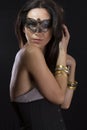 Beautiful young woman in mysterious black Venetian mask Royalty Free Stock Photo