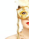 Beautiful young woman in mysterious golden Venetian mask Royalty Free Stock Photo