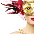 Beautiful young woman in mysterious golden Venetian mask Royalty Free Stock Photo