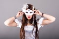 Beautiful young woman with mysterious venetian mask Royalty Free Stock Photo