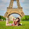 Beautiful young woman near the Eiffel tower Royalty Free Stock Photo