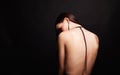 Beautiful young woman with necklace on her naked back Royalty Free Stock Photo