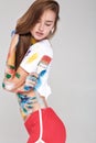 Young woman smeared in multicolored paint. Royalty Free Stock Photo