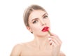 Beautiful young woman paints lips with lipstick. Perfect make-up. Beauty fashion