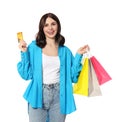 Beautiful young woman with paper shopping bags and credit card on white background Royalty Free Stock Photo