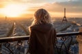 Beautiful young woman in a Parisian balcony with view to the Eiffel tower in Paris, France. AI Generative