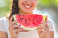 Beautiful young woman at park eating a slice of watermelon Royalty Free Stock Photo