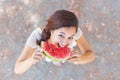 Beautiful young woman at park eating a slice of watermelon Royalty Free Stock Photo