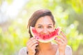 Beautiful young woman at park eating a slice of watermelon Royalty Free Stock Photo