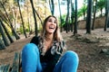 Beautiful young woman in a park having fun with a big laugh Royalty Free Stock Photo