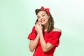 Beautiful young woman with pinup make-up and hairstyle. Studio shot on white background Royalty Free Stock Photo