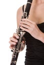 Beautiful young woman playing clarinet