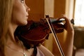 Beautiful young woman playing violin, closeup Royalty Free Stock Photo