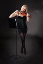 Beautiful young woman playing violin Royalty Free Stock Photo