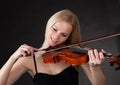 Beautiful young woman playing violin Royalty Free Stock Photo