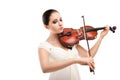 Beautiful young woman playing violin over white Royalty Free Stock Photo