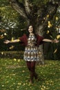 Beautiful young woman plays with leafs Royalty Free Stock Photo