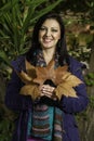 Beautiful young woman plays with leafs Royalty Free Stock Photo