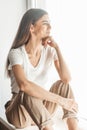 Beautiful young woman portrait behind window Royalty Free Stock Photo