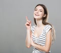 Beautiful young woman portrait cute tender pure smiling posing gray background Royalty Free Stock Photo