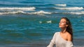 Beautiful young woman portrait enjoy in sun and sea air on beach closed eyes relaxing summer Royalty Free Stock Photo