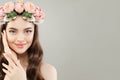 Beautiful young woman portrait. Beautiful face. Model with clear skin, long shiny hair and flowers Royalty Free Stock Photo