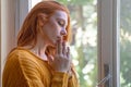 Beautiful young woman portrait praying at home