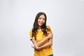 Beautiful young woman portrait. Smiling asian lifestyle concept with crossed arms. Isolated on grey background Royalty Free Stock Photo