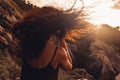 Beautiful young woman portrait at sunset on the top of mountain Royalty Free Stock Photo