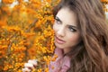 Beautiful young woman portrait, teen girl over autumn yellow par Royalty Free Stock Photo