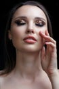 Beautiful young woman portrait with vogue shining face makeup an