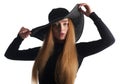 Beautiful young woman posing in black hat isolated on white Royalty Free Stock Photo