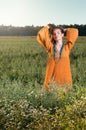 Beautiful young woman posing in a field. Enjoy the summer Royalty Free Stock Photo