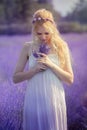 Beautiful young woman posing in a lavender field