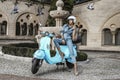 Beautiful young woman is posing on motorbike in the city. Summer vacation style, traveling,stylish outfit. Spring summer fashion Royalty Free Stock Photo